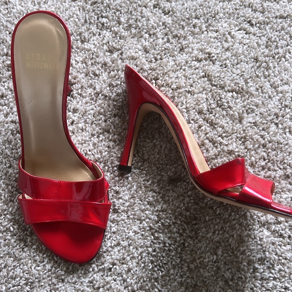 Red patent Stuart Weitzmen heels.